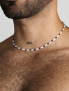 Beaded Necklace with long white beads and small blue lapis beads